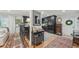 Open living area with barstool seating, black kitchen cabinets, and stylish decor at 2762 Whispering Pines Dr, Decatur, GA 30033