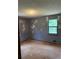 Bedroom features a neutral painted walls and a window letting in natural light at 285 Woodland St, Dallas, GA 30157