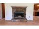 Close-up of a stone fireplace with a wooden mantle in a spacious living room at 285 Woodland St, Dallas, GA 30157
