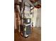 The furnace and water heater system in the utility area at 285 Woodland St, Dallas, GA 30157
