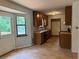 Functional kitchen with wood cabinets, laminate countertops, and a view of the backyard at 285 Woodland St, Dallas, GA 30157