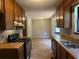 Well-lit kitchen with wood cabinets, essential appliances, and ample counter space at 285 Woodland St, Dallas, GA 30157