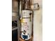 Close up view of a Rheem Fury gas water heater installed on a wood stand at 285 Woodland St, Dallas, GA 30157