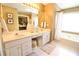 Bright bathroom with double vanity, large mirror, and a soaking tub with natural light at 318 Ivy Manor Nw Dr, Marietta, GA 30064
