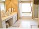 Bright bathroom features white tile, bathtub and shower, and neutral wall colors at 318 Ivy Manor Nw Dr, Marietta, GA 30064