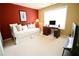 Cozy bedroom with red accent wall, desk, and a large window for natural light at 318 Ivy Manor Nw Dr, Marietta, GA 30064