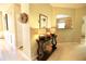 View of a decorated hallway table with lamps and a glimpse into the kitchen at 318 Ivy Manor Nw Dr, Marietta, GA 30064