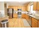 Updated kitchen featuring stainless steel appliances, granite countertops, and wood cabinets at 318 Ivy Manor Nw Dr, Marietta, GA 30064