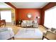 Cozy living room features neutral decor, hardwood floors, and abundant natural light from large windows at 318 Ivy Manor Nw Dr, Marietta, GA 30064