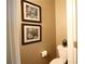 Tastefully decorated powder room featuring a toilet, artwork, and neutral tones at 318 Ivy Manor Nw Dr, Marietta, GA 30064