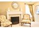 Cozy sitting area with fireplace and decorative chairs, perfect for relaxation at 318 Ivy Manor Nw Dr, Marietta, GA 30064