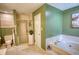 View of the spacious bathroom showing the jacuzzi tub, shower, and toilet at 78 N Pomona Rd, Hampton, GA 30228