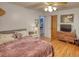 Comfortable bedroom with a view, featuring hardwood floors and natural light at 78 N Pomona Rd, Hampton, GA 30228