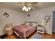 Bedroom featuring a ceiling fan and a cozy decor theme at 78 N Pomona Rd, Hampton, GA 30228