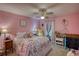 Pink themed bedroom showcasing personalized decor and ample natural light at 78 N Pomona Rd, Hampton, GA 30228