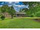 Beautiful single-Gathering home with a well-maintained lawn and a charming front porch, surrounded by mature trees at 78 N Pomona Rd, Hampton, GA 30228