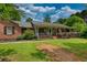 Attractive single-Gathering home boasting a welcoming front porch and lush landscaping for great curb appeal at 78 N Pomona Rd, Hampton, GA 30228
