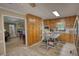 Open kitchen with wood cabinets, stainless appliances, and seamless flow to the living area at 78 N Pomona Rd, Hampton, GA 30228