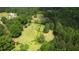 Large lot featuring lush greenery, mature trees, and sprawling lawn, providing privacy and space at 78 N Pomona Rd, Hampton, GA 30228