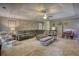 Inviting living room with comfortable seating, a stone fireplace, and a decorative ceiling, ideal for relaxing and entertaining at 78 N Pomona Rd, Hampton, GA 30228