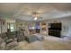 Spacious living room featuring a cozy sectional sofa and modern entertainment center at 78 N Pomona Rd, Hampton, GA 30228