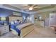 Serene main bedroom featuring a tray ceiling, neutral decor, and ample closet space at 78 N Pomona Rd, Hampton, GA 30228