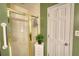 An accessible shower is shown in the bathroom, complete with safety bar and door at 78 N Pomona Rd, Hampton, GA 30228