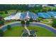 Aerial view of community clubhouse with pool, fountains, and tennis courts in a well-manicured neighborhood at 1420 Baygreen Rd, Suwanee, GA 30024