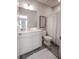 Clean bathroom featuring white vanity, large mirror, and shower with modern fixtures and tile flooring at 1420 Baygreen Rd, Suwanee, GA 30024