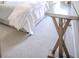 Bright bedroom featuring light colored carpet and a sleek console table at 1420 Baygreen Rd, Suwanee, GA 30024