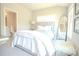 Bright bedroom featuring a full-length mirror and ensuite bathroom at 1420 Baygreen Rd, Suwanee, GA 30024