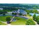 Resort-style community clubhouse featuring a pool, tennis courts, and beautifully landscaped grounds at 1420 Baygreen Rd, Suwanee, GA 30024