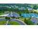 Upscale community clubhouse with a pool, tennis courts, and professionally maintained landscaping at 1420 Baygreen Rd, Suwanee, GA 30024