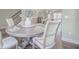 Elegant dining area featuring a chandelier, table with seating and adjacent kitchen at 1420 Baygreen Rd, Suwanee, GA 30024