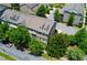 Attractive townhome with a brick facade, dormer windows, professional landscaping, and nearby parking at 1420 Baygreen Rd, Suwanee, GA 30024