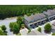 Townhome featuring a covered patio, attached garage, and well-maintained landscaping for relaxed living at 1420 Baygreen Rd, Suwanee, GA 30024