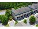 Beautiful townhome boasting a covered patio, attached garage, and charming landscaping for a comfortable lifestyle at 1420 Baygreen Rd, Suwanee, GA 30024