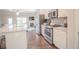 Contemporary kitchen with stainless steel appliances and granite countertops at 1420 Baygreen Rd, Suwanee, GA 30024