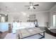 Bright living room with lots of natural light, white sofa, and a view into the kitchen at 1420 Baygreen Rd, Suwanee, GA 30024