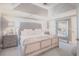 Beautiful main bedroom boasts a large upholstered bed frame and a spacious layout with a full-length mirror at 1420 Baygreen Rd, Suwanee, GA 30024