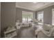 Bright home office with hardwood floors, neutral walls, and natural light from multiple windows at 1420 Baygreen Rd, Suwanee, GA 30024