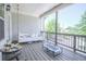 Relaxing outdoor porch featuring a swing and view of the neighborhood at 1420 Baygreen Rd, Suwanee, GA 30024