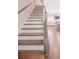 Staircase in a home with wood and white trim at 1420 Baygreen Rd, Suwanee, GA 30024
