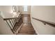 View of the staircase with wooden steps and decorative iron railing, leading to the home's entryway at 1420 Baygreen Rd, Suwanee, GA 30024