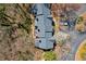 Aerial view of townhome rooftops and decks overlooking landscaped grounds at 220 Riverview Trl, Roswell, GA 30075