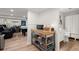 Finished basement area with kitchenette, bathroom, pool table, and seating at 220 Riverview Trl, Roswell, GA 30075
