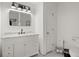 Modern bathroom with black and white accents, featuring a stylish vanity and contemporary fixtures at 220 Riverview Trl, Roswell, GA 30075