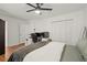 This bedroom has hardwood floors, a ceiling fan, a large closet and an additional desk area at 220 Riverview Trl, Roswell, GA 30075