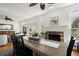 Open-plan dining room featuring a fireplace and views through the windows at 220 Riverview Trl, Roswell, GA 30075