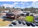 Exterior view of building with outdoor seating area and ample parking surrounded by mature trees at 220 Riverview Trl, Roswell, GA 30075